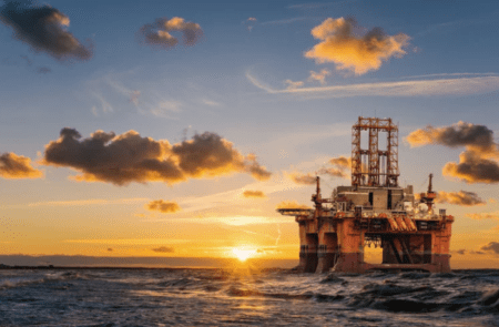 Offshore oil rig at sunset